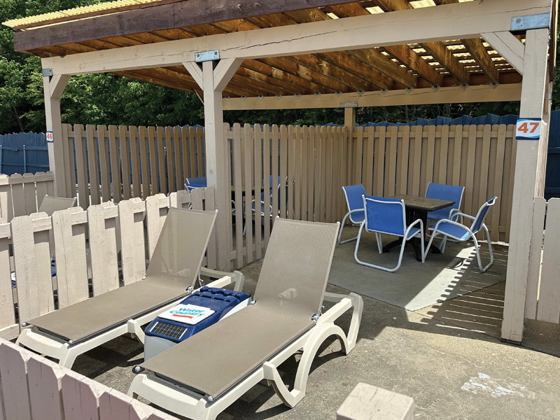 three people in a cabana