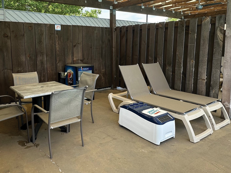 three people in a cabana