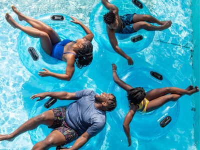 Family in the pool on tubes 